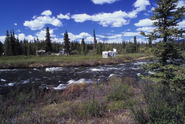 RVs parked at Brushkana Creek Campground just on the other side of the creek.