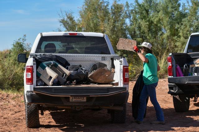  Cheryl Martinez, troop leader of Girl Scouts of the Desert Southwest Troop 18044, places trash in the back of a pickup truck during a National Public Lands Day cleanup event at the Bureau of Land Management Roswell Field Office’s Oxbow Day Use Area on Sept. 12.