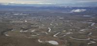 Aerial photo of the tundra and rivers of the Northeast National Petroleum Reserve in Alaska.