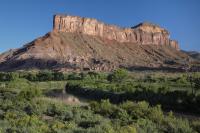 palisade wsa with river in foreground mesa in background