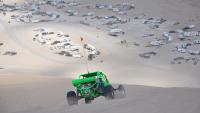 Dune buggy driving across sand dunes