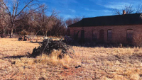 A pile of slash and debris near one of the buildings on the Little Boquillas Ranch.