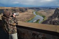 Person overlooking the Snake River canyon area.