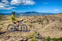 A mountain biker overlooks the San Luis Valley.