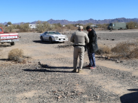 A Ranger is talking to a man. 