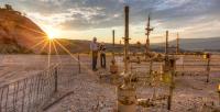Two BLM workers at an oil and gas facility in Colorado.