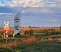 A photo of a sign in a field