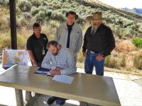 Casey Hammond signing the Blackrock Land Exchange ROD