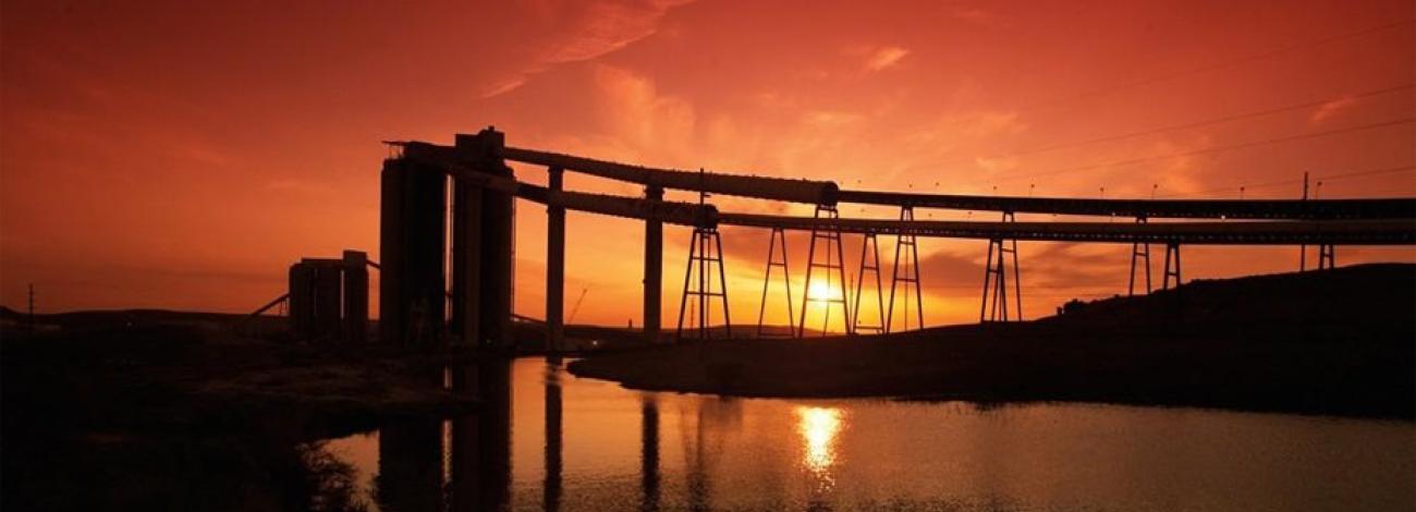 2 Coal Silos and associated Conveyors at sunset