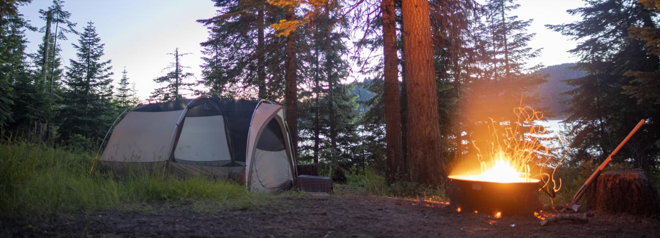 Campfire at the Hyatt Lake Campground with a tent nearby