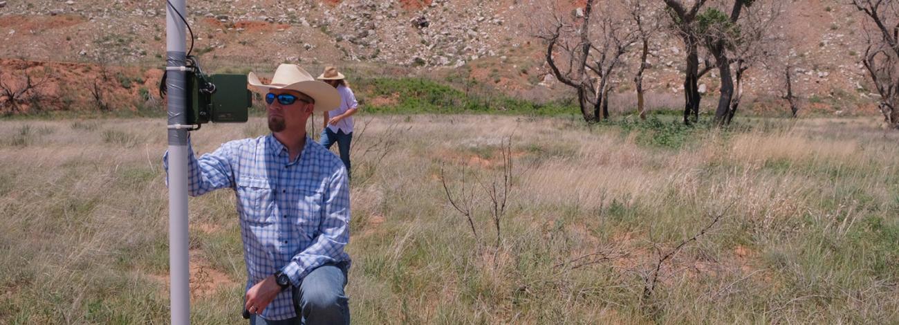 Oklahoma Field Office Wildlife Biologist Brian Dickerson programs a SM4BAT-FS acoustic monitoring device in an effort to understand what bat species may be present on the Cross Bar Management Area.