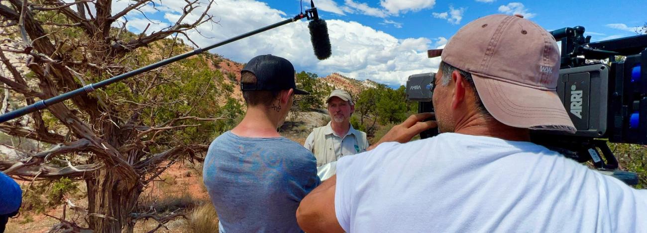 BLM employee being interviewed by a camera crew outdoors