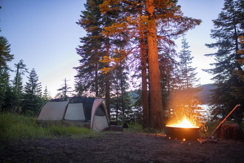 Campfire at the Hyatt Lake Campground with a tent nearby