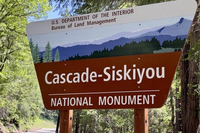 Cascade-Siskiyou National Monument sign surrounded by trees