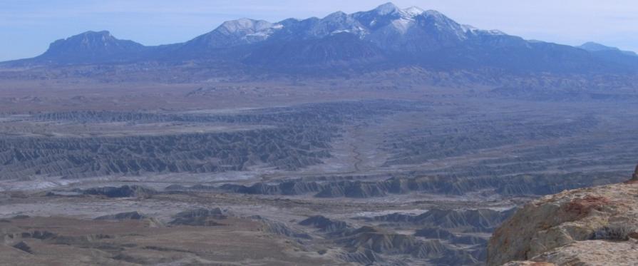 low mesas and barren badlands carved by erosion from blue-gray marine shales. The Mt. Ellen portion of the WSA consists of steep slopes and rounded peaks