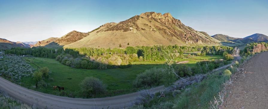 A landscape view of a road winding through the Idaho country side. BLM photo.