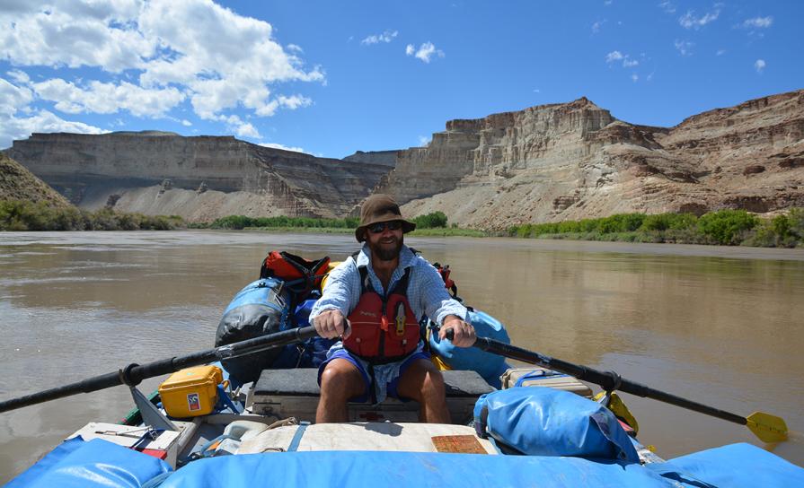 A river ranger rows a raft down the Gray Canyon.