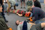 People practicing first aid.