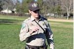 A BLM ranger in an open grassy field