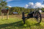 A replica cannon and sign greet visitors to Fort Egbert.