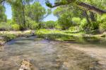 A creek runs through a desert area