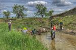 An MCC crew installing a structure that mimics a log jam on Box Elder Creek, downstream from Brady and Nowlin’s houses in May 2023.