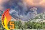 Thick smoke rises from a forested mountain landscape. An overlayed graphic displays the number 5 and a flame. 