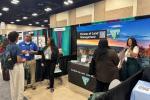 Kenneth Barber, BLM Wyoming; Christal Smaw, BLM Alaska; and Brooke Wheeler, BLM Arizona, speaking to students at the AISES Career Booth.