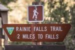 A trailhead marker that reads Rainie Falls Trail 2 Miles to Falls. 