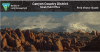 Moab Visitor Guide brochure cover with a scene of sandstone fins and snow-capped mountains behind them